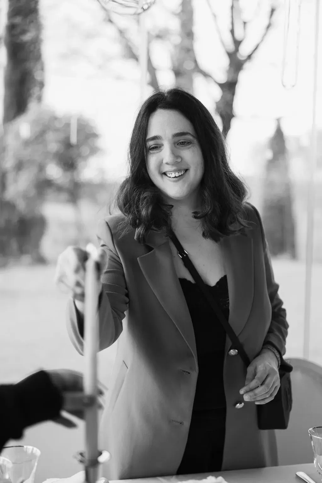 Roberta, Italian Knot wedding planner, smiling amidst Italian wedding venue details.
