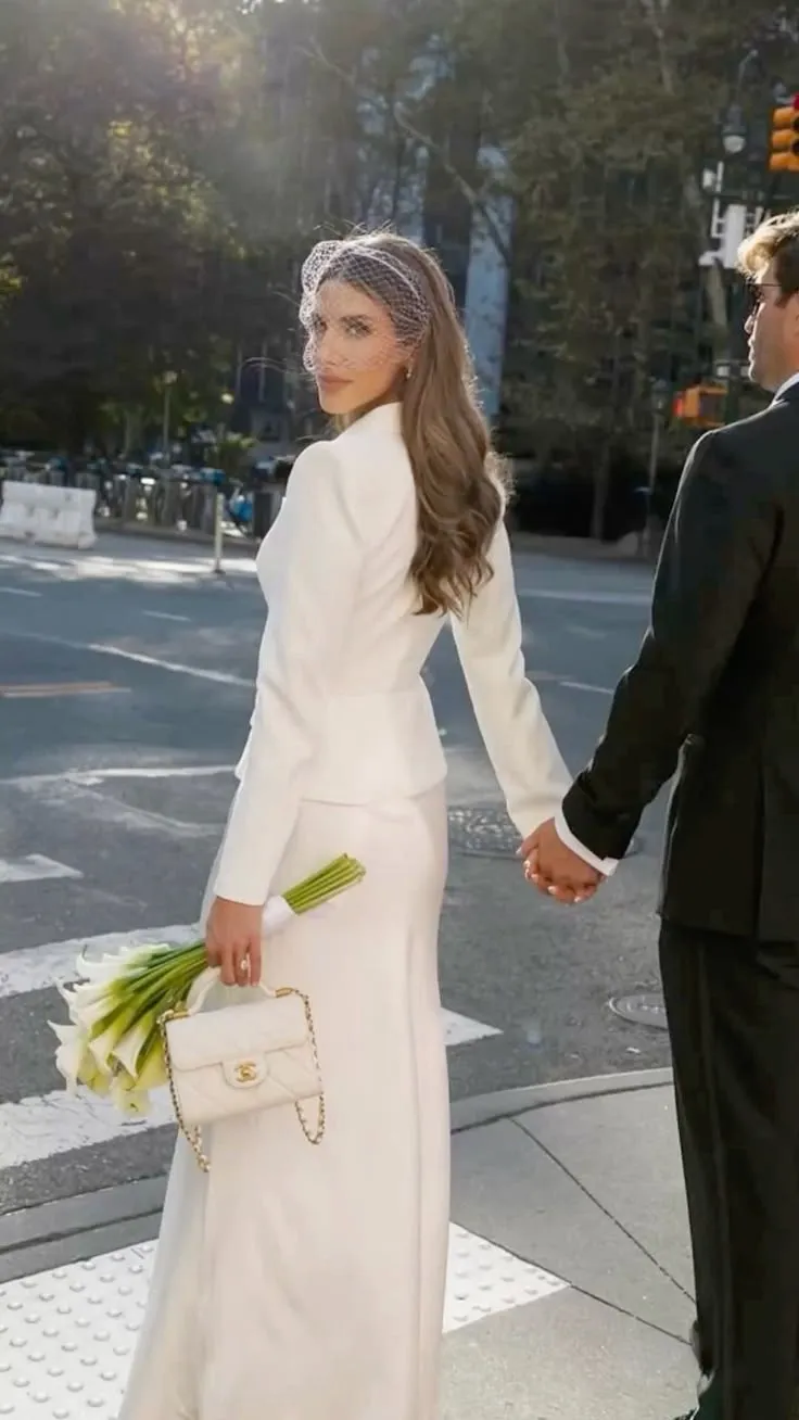 Couple reviewing bespoke wedding attire with an Italian designer