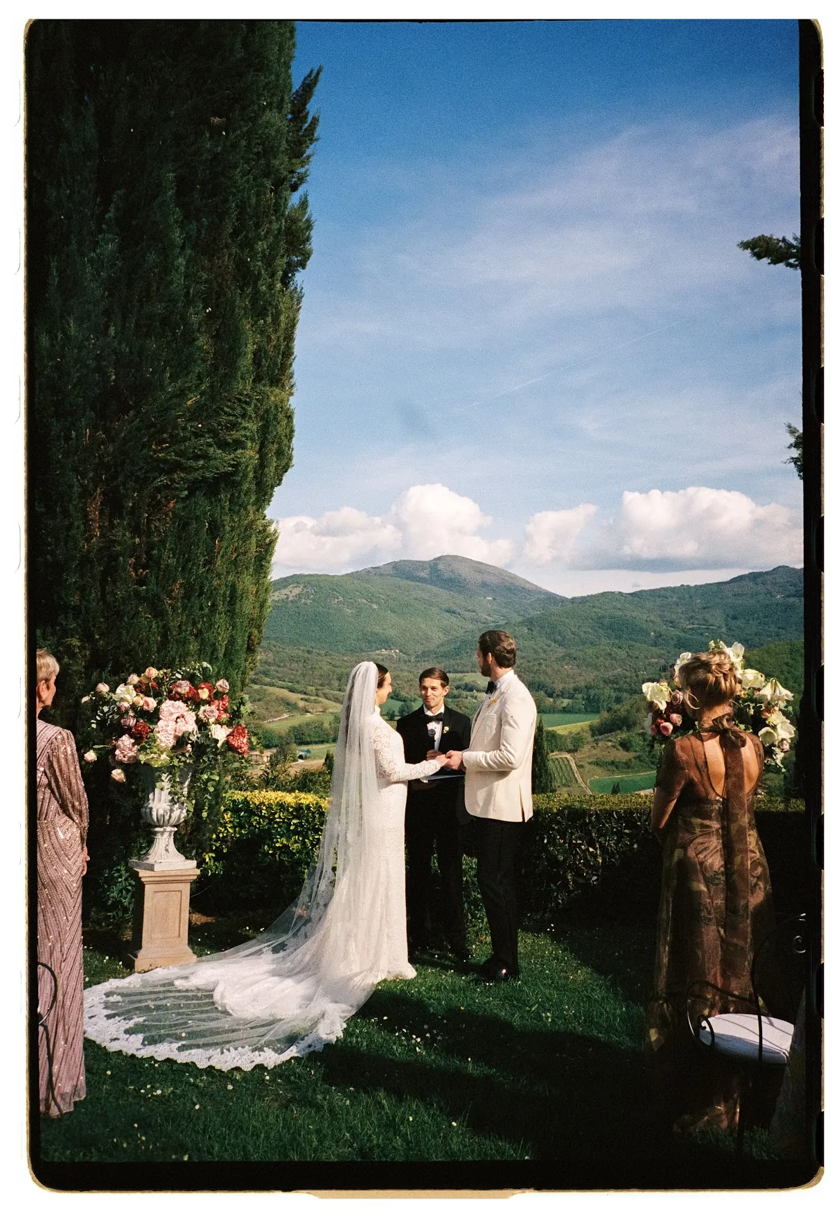 Garden ceremony terrace framed by cypress trees in Umbria